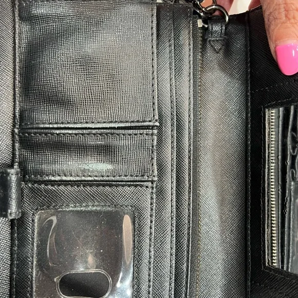 Tory Burch black large wallet with many compartments.